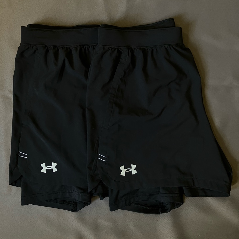 Two Under Armour Shorts with built in spandex with pockets